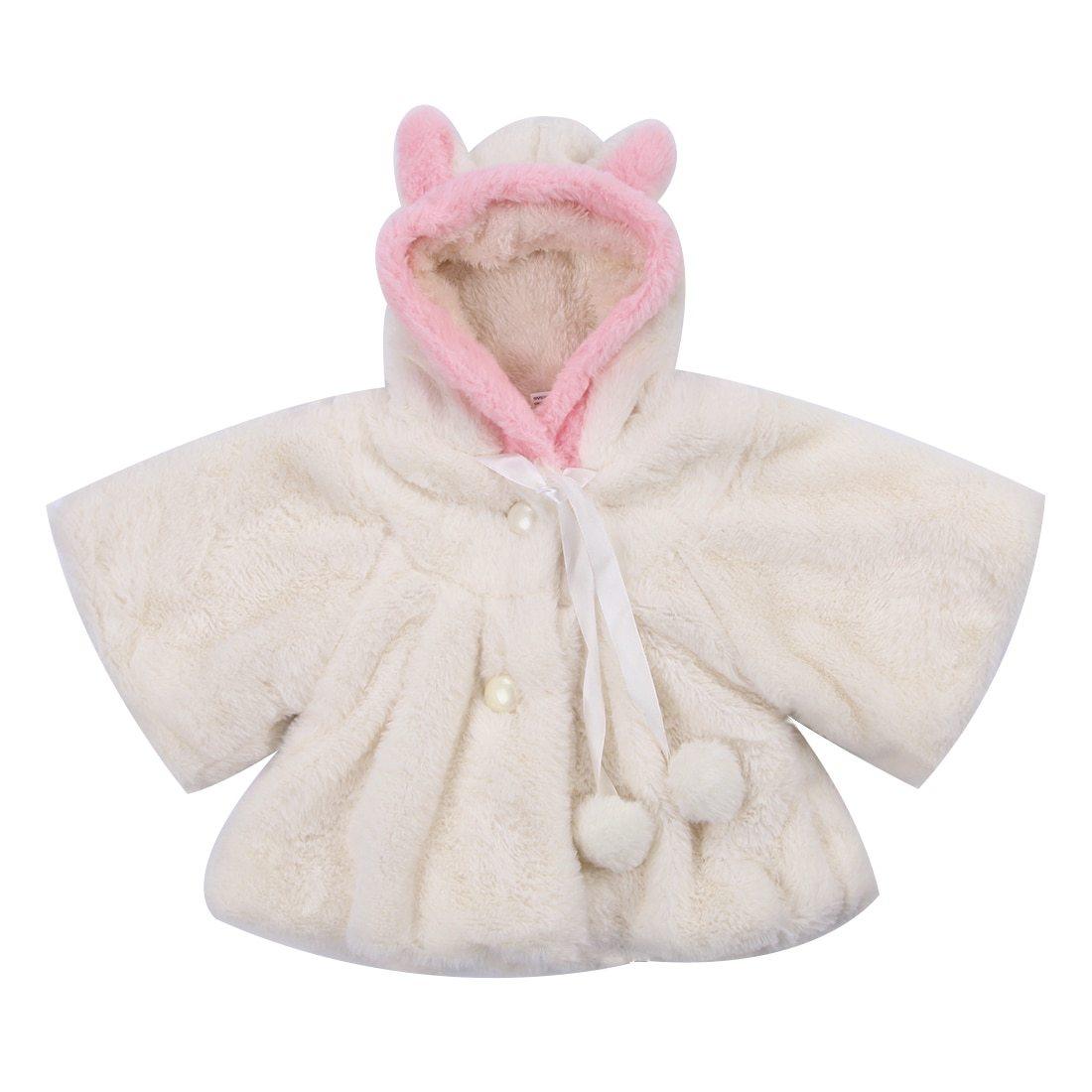 Ivory faux-fur baby coat cloak with hood, bow tie, pom pom trim, and pearl buttons