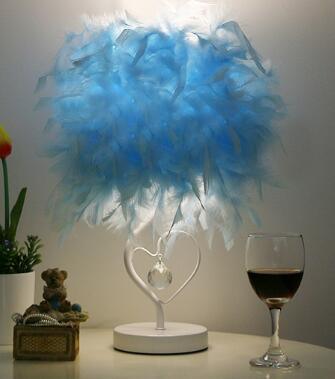 Blue feather heart-shaped table lamp with crystal heart charm on white base