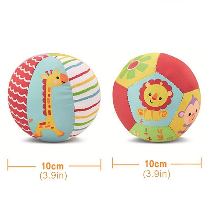 Pair of soft plush baby rattle balls with giraffe and lion animal designs