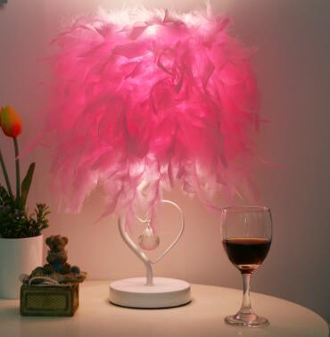 Pink feather heart-shaped table lamp with crystal heart charm on white base