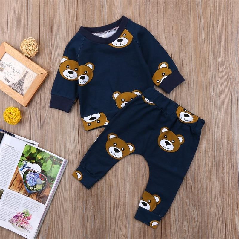 Navy long-sleeve boys pajama set with cute bear face prints on shirt and pants