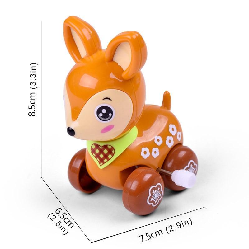 Orange and brown cartoon dog wind-up car rattle with paw prints and heart chest