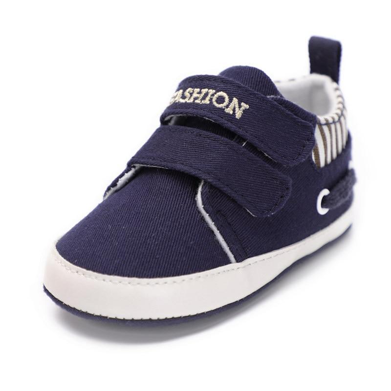 Infant canvas sneakers, navy slip-on with hook-and-loop strap and white sole