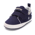 Infant canvas sneakers, navy slip-on with hook-and-loop strap and white sole