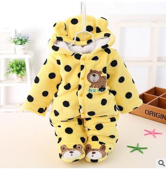 Yellow hooded plush baby romper with polka dots, bear chest patch, and character booties