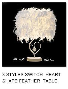 White feather heart-shaped table lamp with crystal pendant on a round base