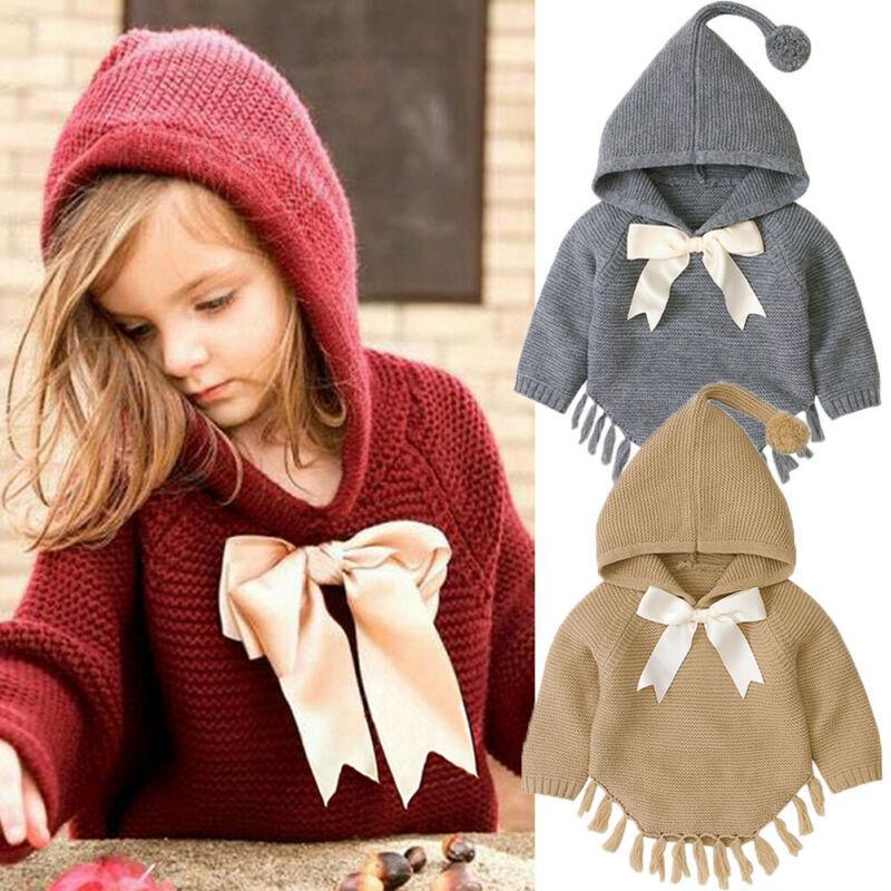 Knitted hooded toddler pullover coat with white bow and tassel-trim hem, burgundy/dark gray
