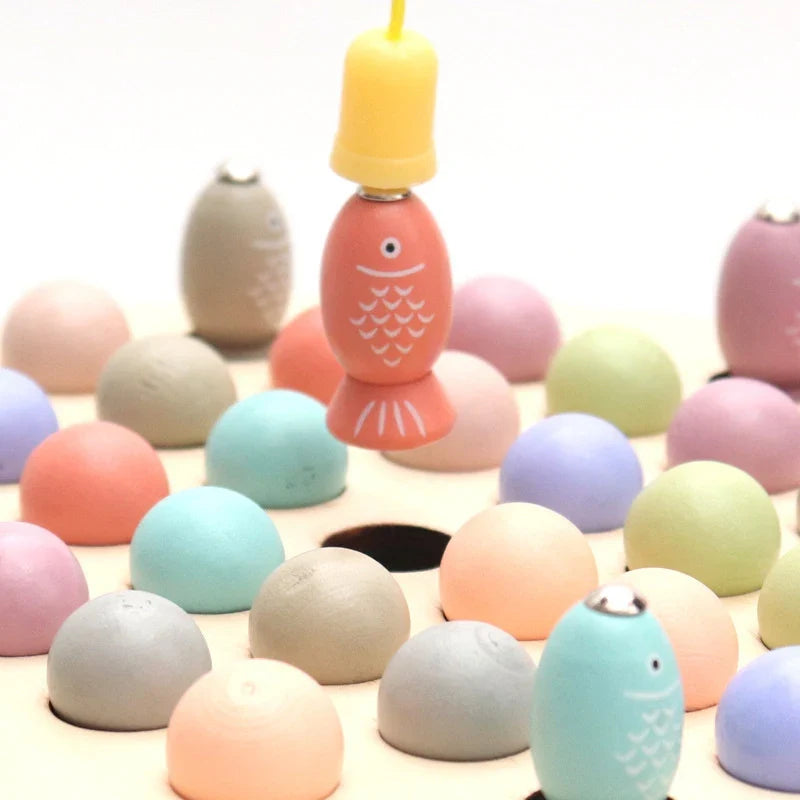 Orange fish-shaped magnet bead on round wooden base with pastel pieces