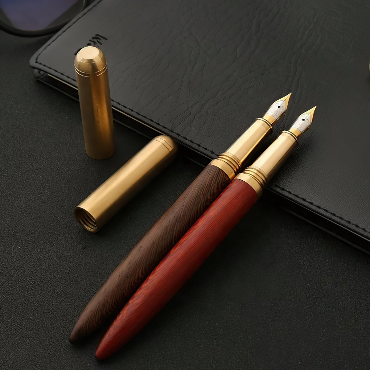 Handmade fountain pens with wood barrels and gold-toned caps