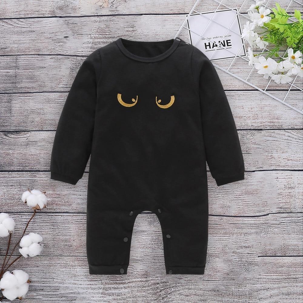 Newborn cotton romper, black long sleeves with golden crescent-face eyes