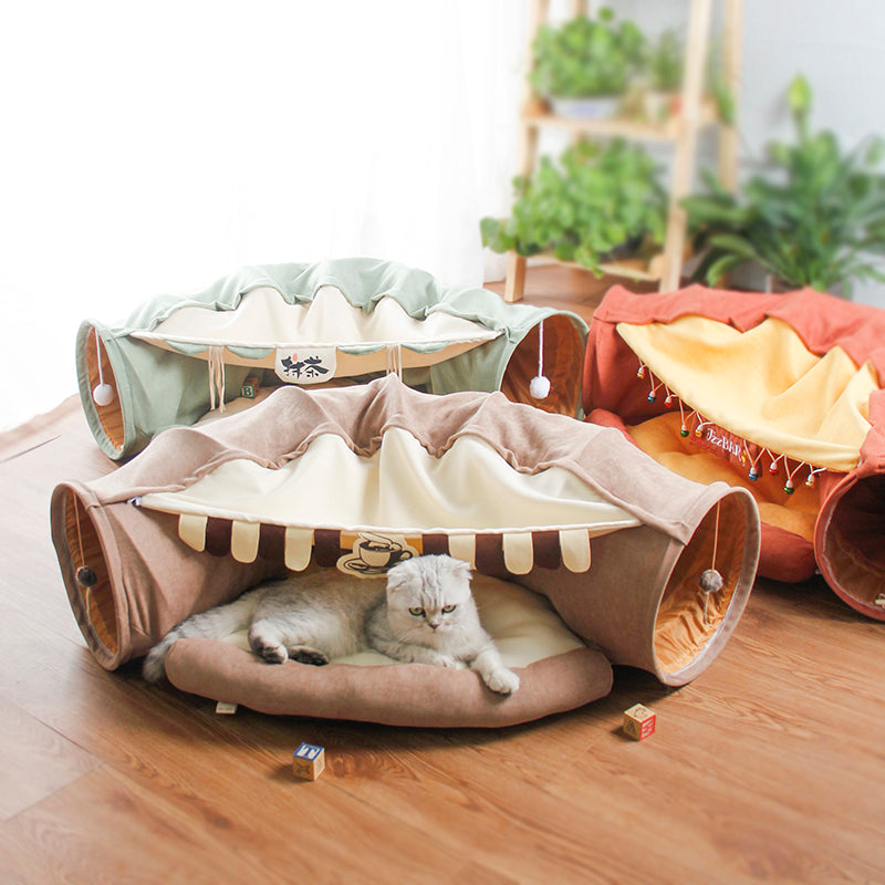 Cat tunnel tube with removable bed set, green fabric and beige interior, cat inside