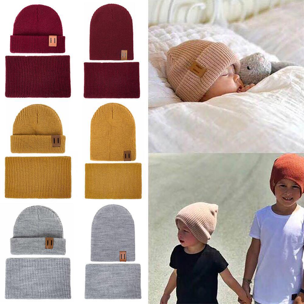 Maroon knit baby beanie and matching neck warmer, shown with other color swatches