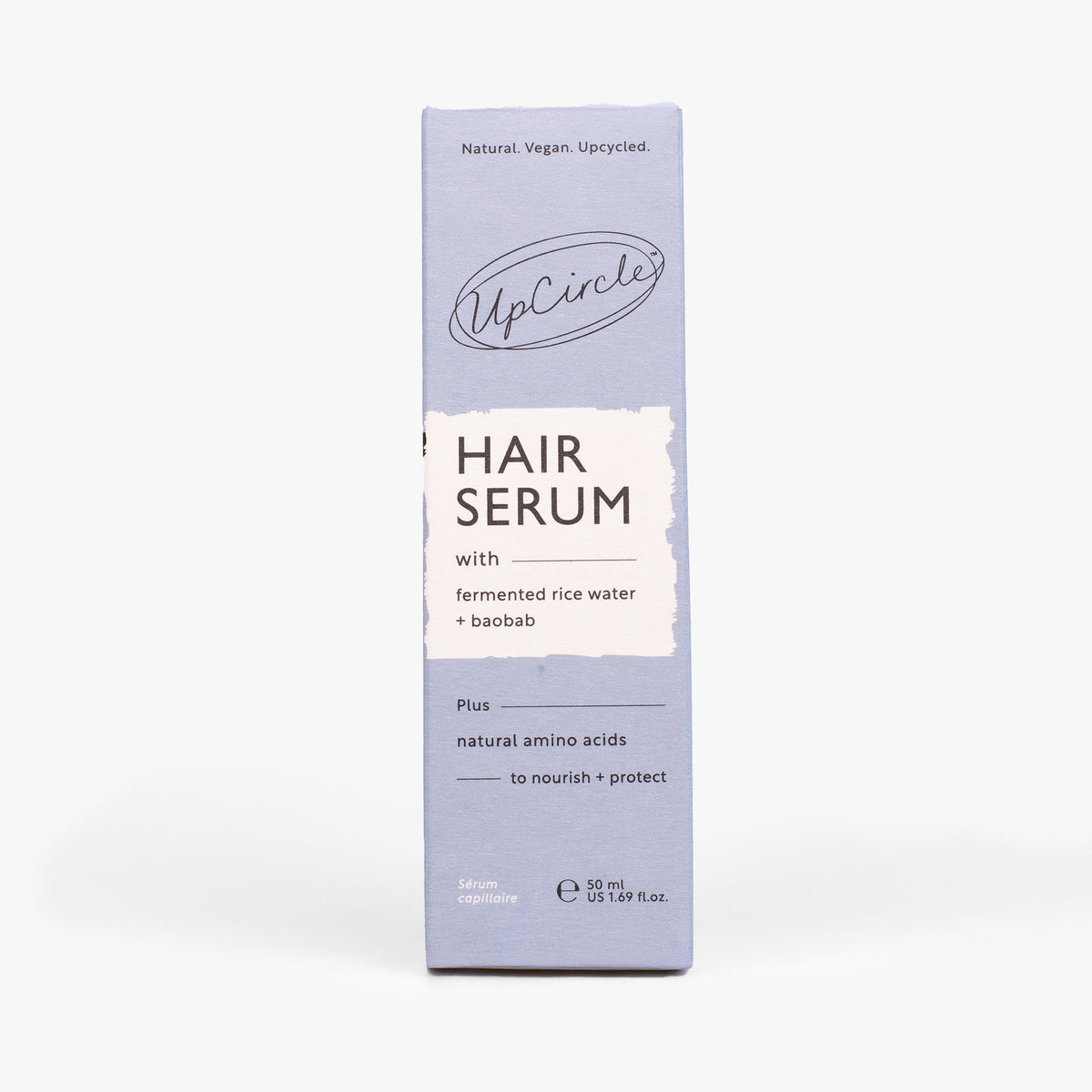 Hair serum carton box with front label and black UpCircle logo