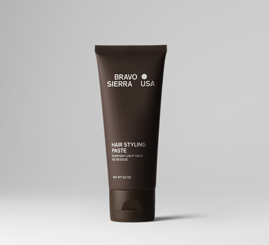 Hair styling paste tube, brown squeeze tube with label and flip-top cap