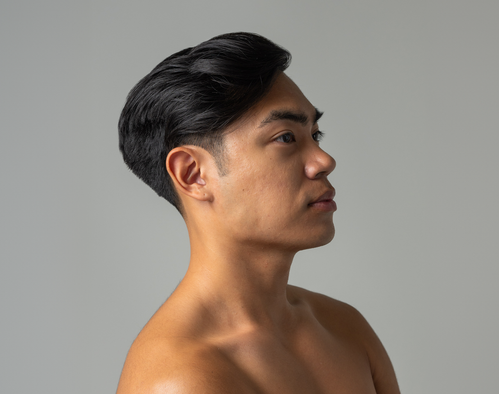 Neatly styled men’s dark hair with light hold texture