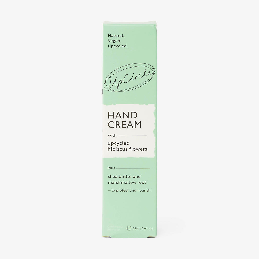 UpCircle green hand cream tube with side panel and ingredient highlights