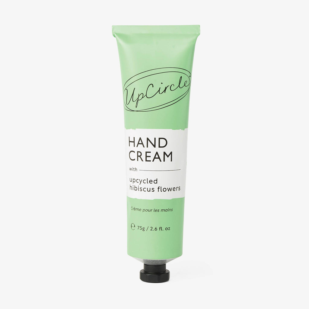 UpCircle green hand cream tube with hibiscus flower label