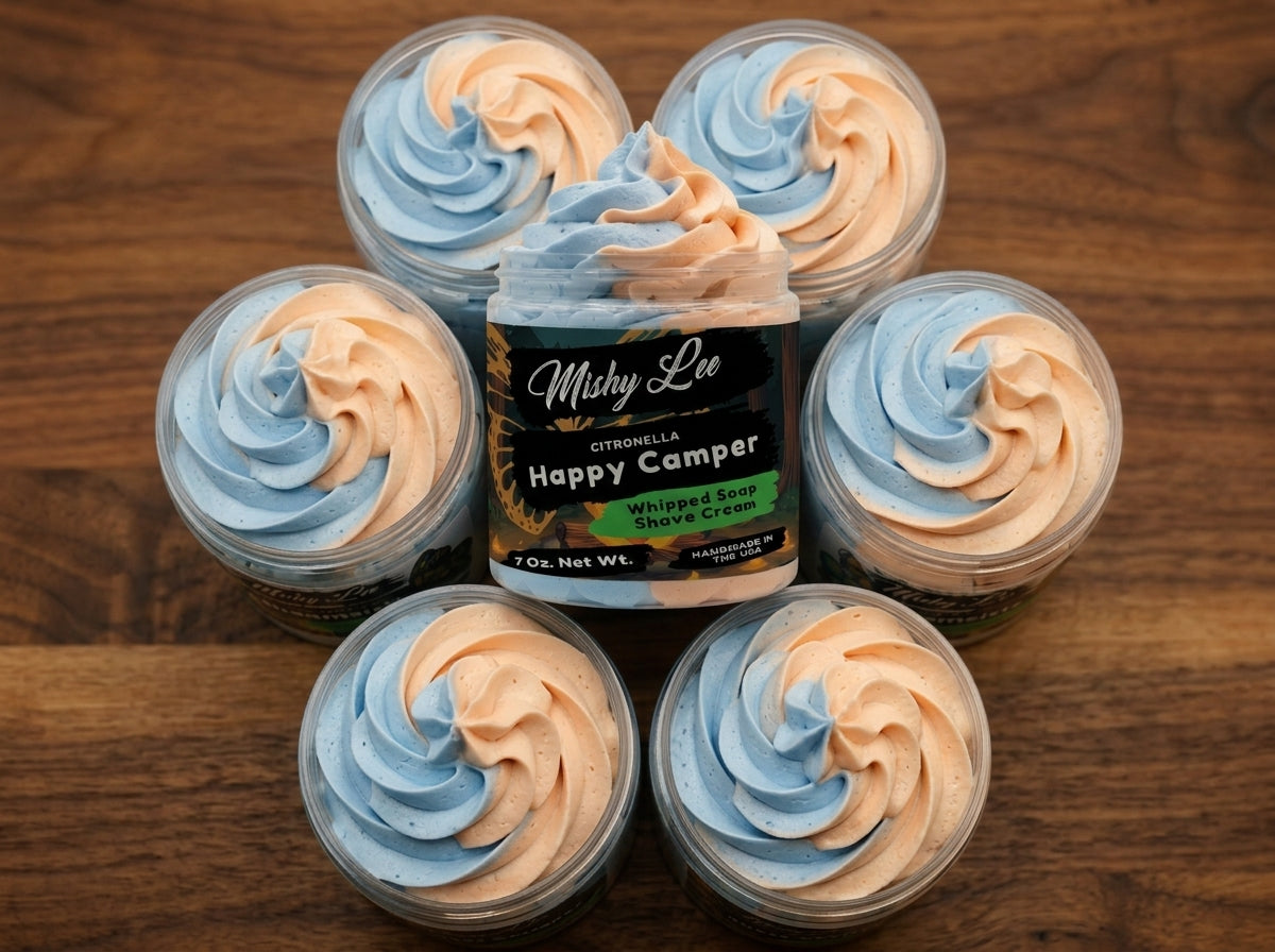 Set of whipped soap containers with blue and peach swirls centered around Happy Camper jar