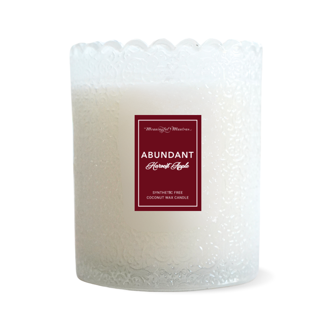 Frosted white glass jar candle with embossed pattern, scalloped top, and red label