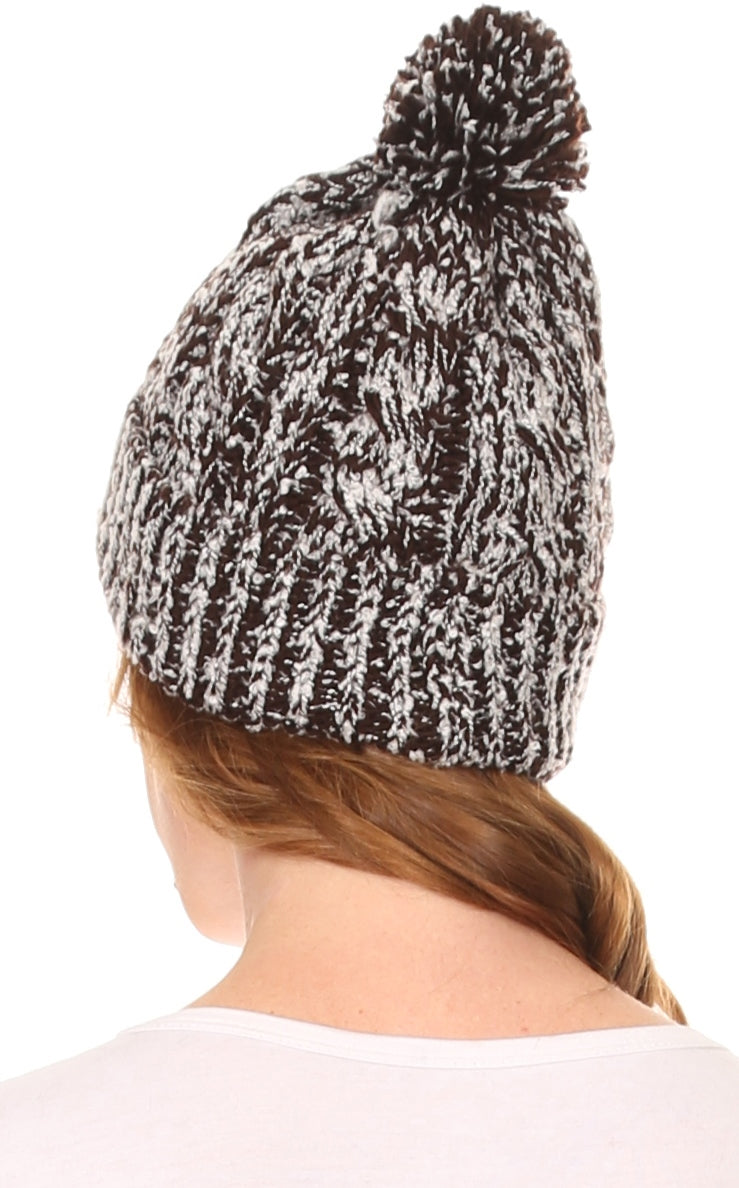 Speckled black-and-white textured knit pom pom beanie hat, back/side view