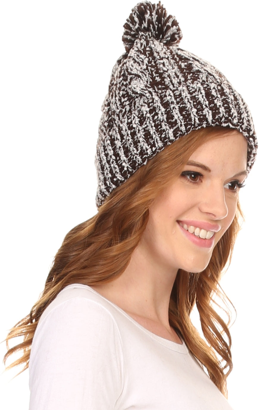 Black-and-white speckled textured knit pom pom beanie hat with ribbed cuff, side view