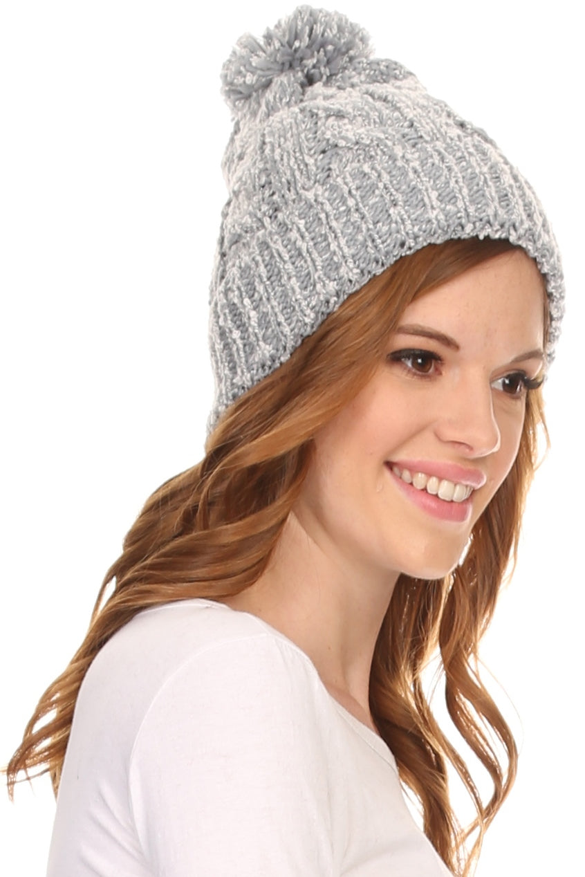 Light grey heathered knit pom pom beanie hat with ribbed cuff, side view
