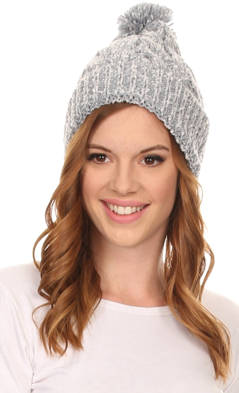 Light grey textured knit pom pom beanie hat with ribbed cuff, front view