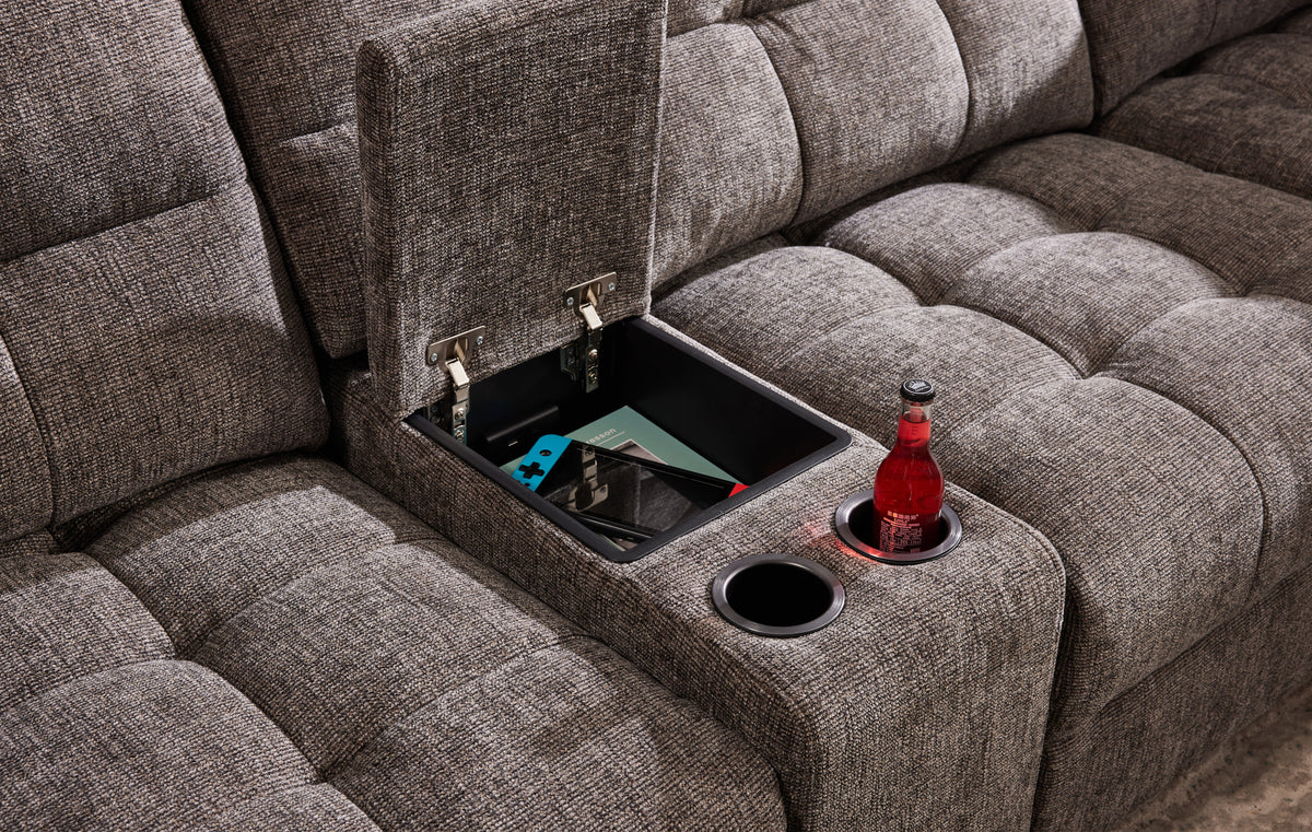 Gunmetal gray sectional with open storage compartment and cup holder in armrest.