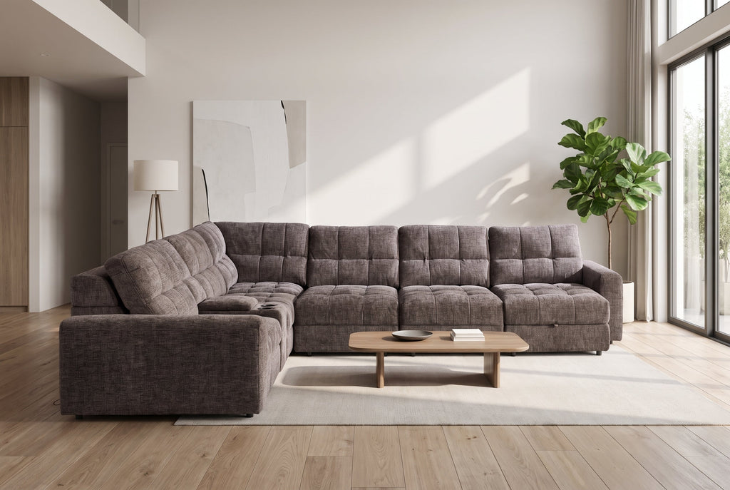 Gunmetal gray sleeper sectional sofa with padded back cushions and chaise section.