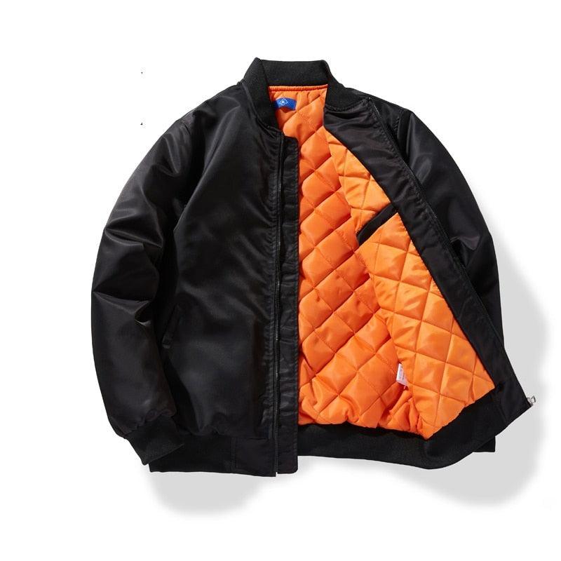 Black padded jacket with orange quilted interior and diagonal contrast panel, zip front