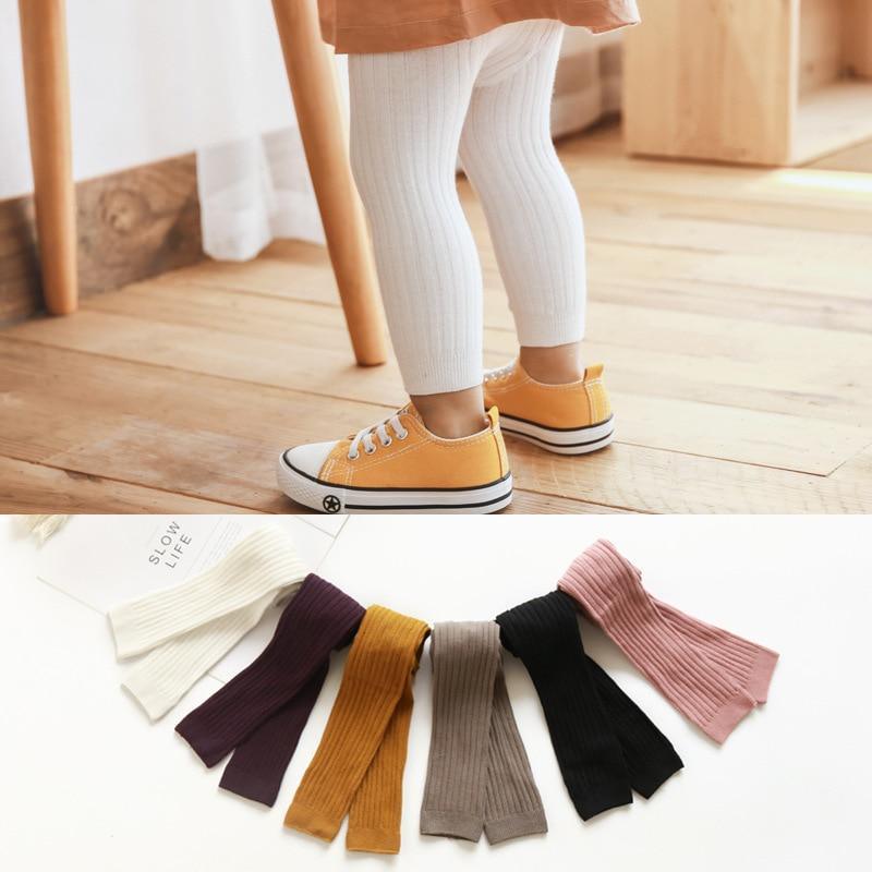 Toddler stretch leggings, white ribbed knit with elastic cuffs and ankle length.