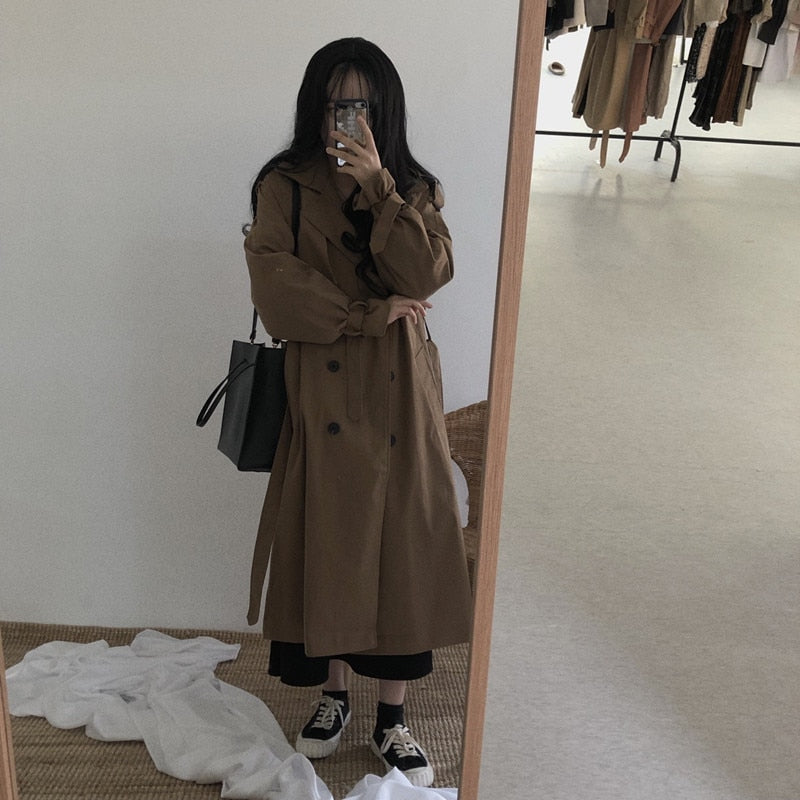 Brown long double-breasted overcoat with button front and belt tie