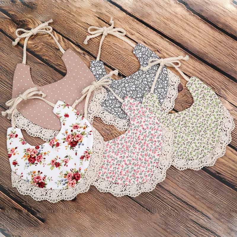 Infant bib set with lace trim and floral, polka-dot, and beige designs