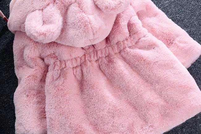 Pink hooded plush jacket with elastic waist and rounded hood shape