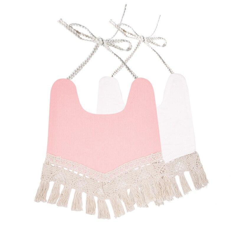 Infant bandana bib set with pink top panel, white lace trim and tassel fringe