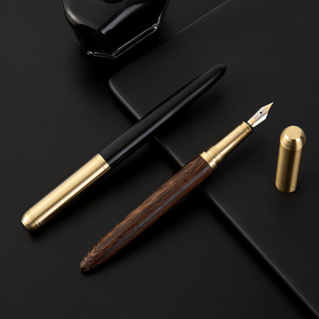 Handmade fountain pen with wood barrel, gold trim, and silver nib