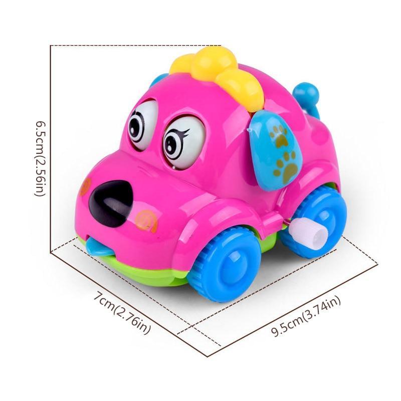 Pink cartoon dog wind-up car rattle with blue wheels and paw print side