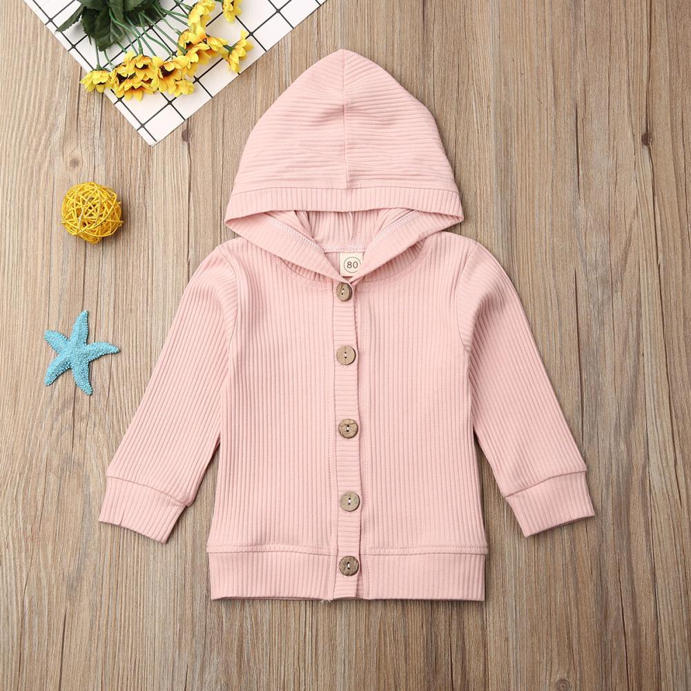 Infant pink hooded knit jacket with long sleeves, button placket, and ribbed hem