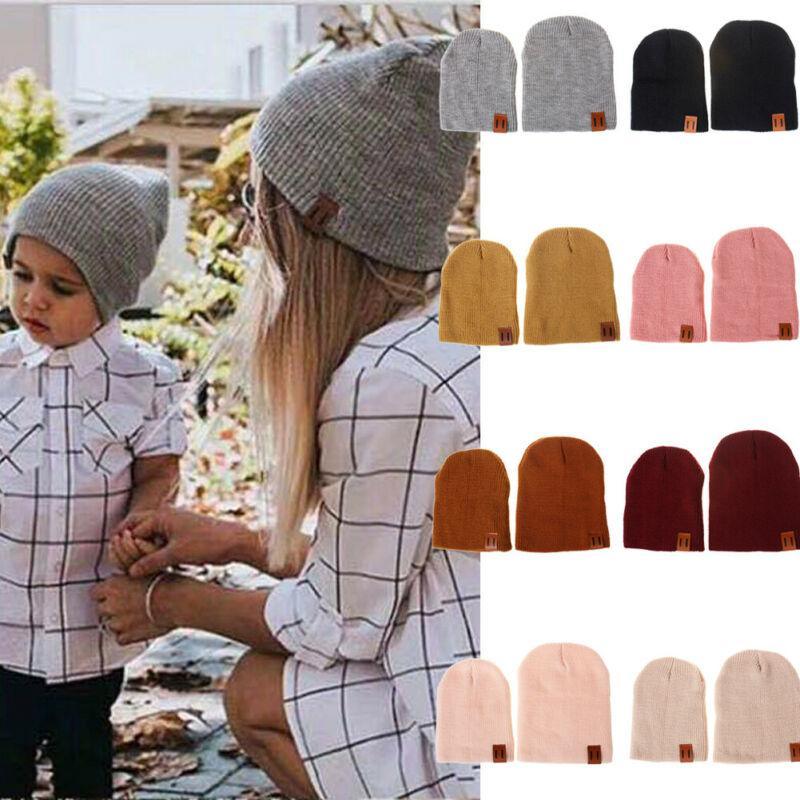 Gray knit beanie hat with small front label patch