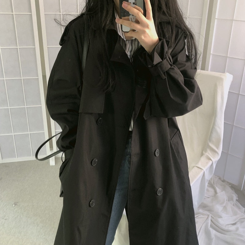 Black double-breasted long coat with notch collar and button front
