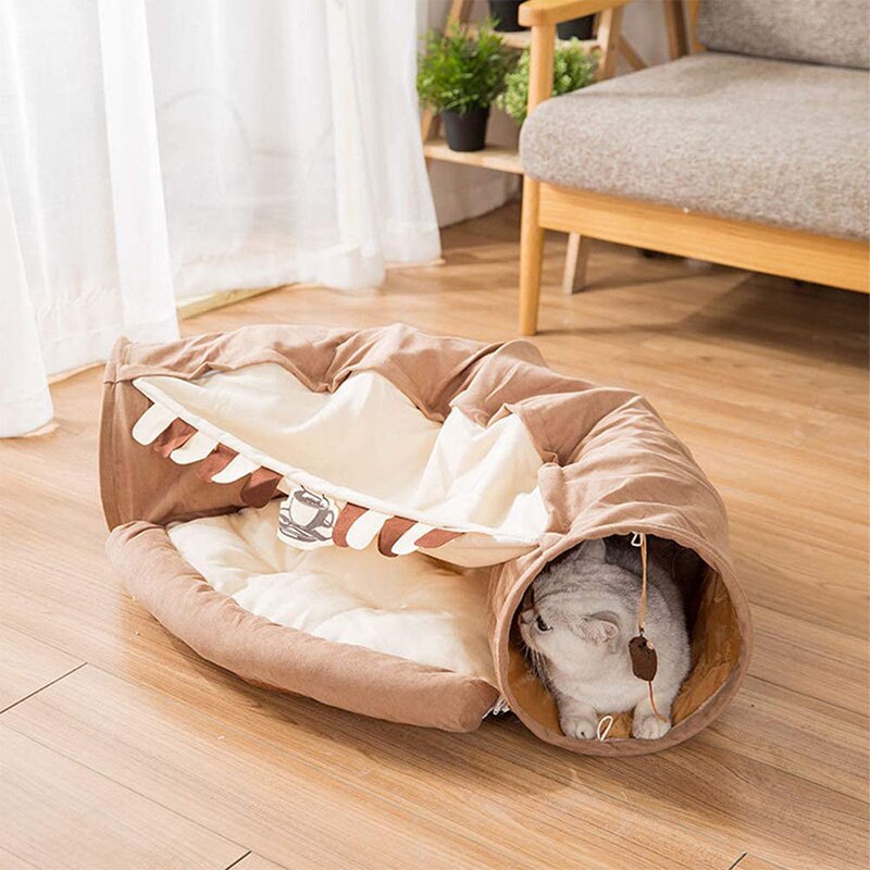 Collapsible cat tunnel tube with removable cushion, beige-and-brown fabric, cat peeking out