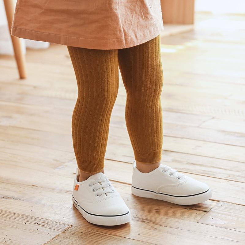 Toddler stretch leggings, golden brown ribbed knit with ankle cuffs.