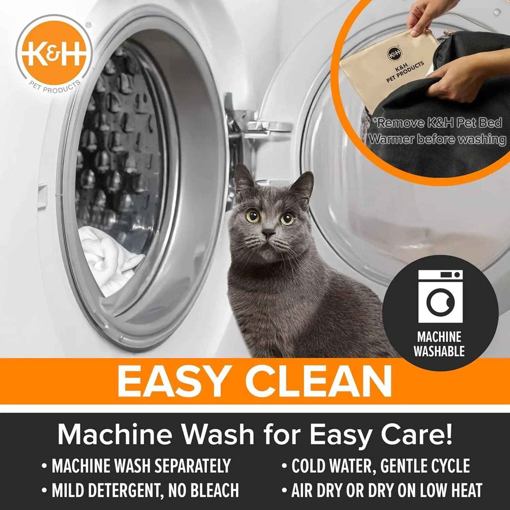 Heated cat bed with removable warmer pad shown beside a washing machine