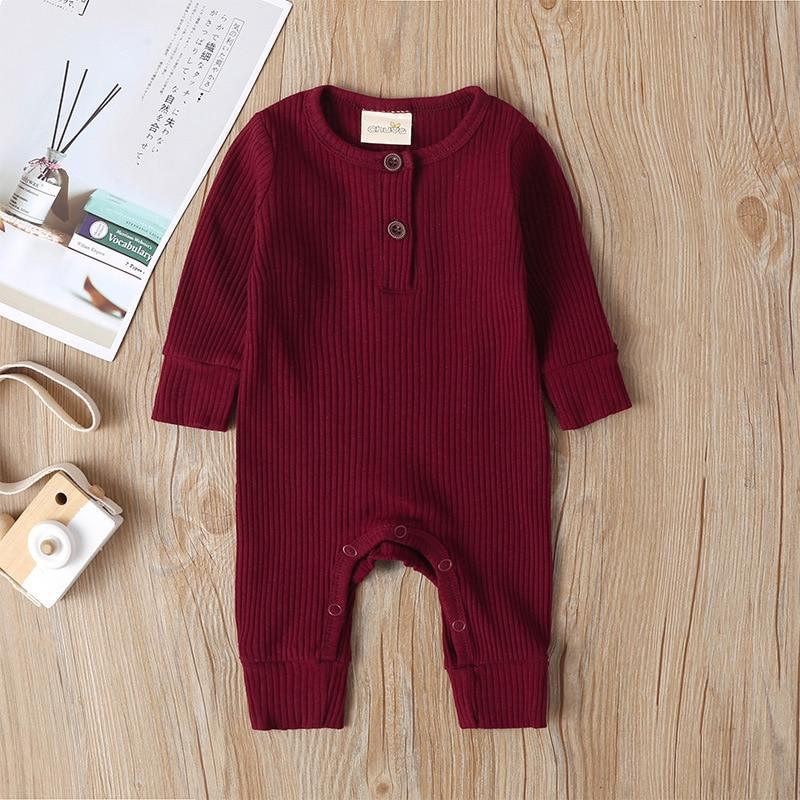 Newborn ribbed henley-style romper in deep red with button placket and footless legs