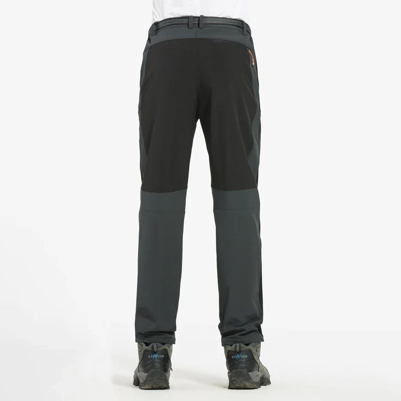 Men's waterproof hiking pants, black with darker panels and ankle cuff