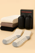 Hand warmer pouch set with dark socks and cream crew socks