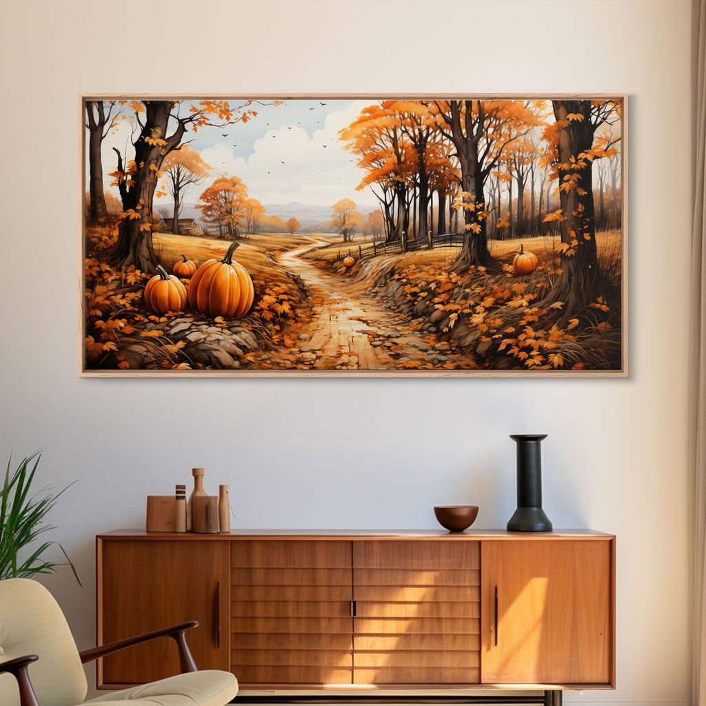 Framed fall canvas wall art with pumpkins, orange trees, and a winding country path