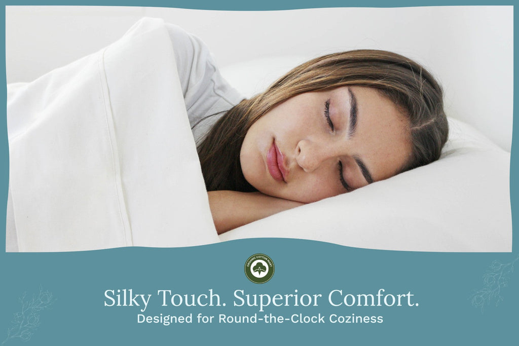 White bed sheet set covering a sleeper on a pillow