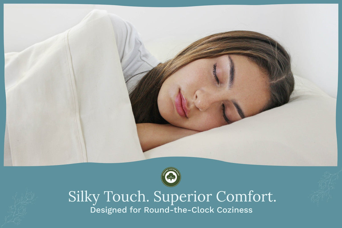 Light cream bed sheets set on a sleeping person, pillow and sheet visible