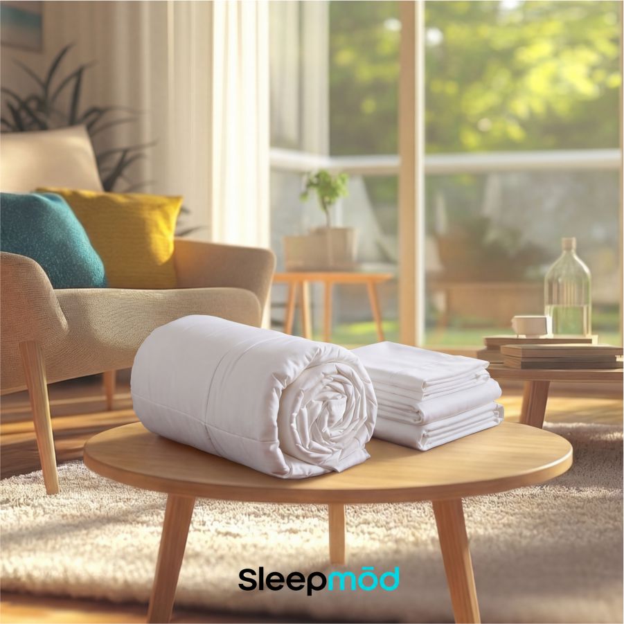 White comforter set with rolled duvet and matching pillow shams